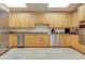 Spacious kitchen equipped with stainless steel appliances and ample wooden cabinetry at 331 Cleveland St # 320, Clearwater, FL 33755