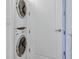 Stackable washer and dryer in a bright, white laundry area at 331 Cleveland St # 320, Clearwater, FL 33755