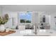 Open concept living room with large windows providing ample natural light at 331 Cleveland St # 320, Clearwater, FL 33755