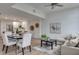 Bright and modern living room features a dining area and open-concept kitchen at 331 Cleveland St # 320, Clearwater, FL 33755