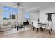 Well-lit living room featuring a large sectional sofa and expansive windows at 331 Cleveland St # 320, Clearwater, FL 33755