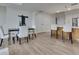 Open-concept living area featuring a dining table, kitchen island, and stylish modern decor at 331 Cleveland St # 320, Clearwater, FL 33755