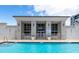 Community pool area and amenities including pool house, ample lounging, and well-maintained landscaping at 331 Cleveland St # 320, Clearwater, FL 33755