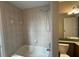 Bathroom featuring a tub with shower head, vanity and toilet at 3355 Abeline Rd, Spring Hill, FL 34608