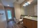 A well lit bathroom features modern vanity and tub/shower at 3355 Abeline Rd, Spring Hill, FL 34608