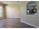 Dining room with a view of the kitchen with new floors, neutral paint, and abundant natural light at 3355 Abeline Rd, Spring Hill, FL 34608