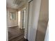 Hallway features wood floors leading to bedrooms and bathrooms at 3355 Abeline Rd, Spring Hill, FL 34608