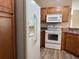 Well-lit kitchen includes modern appliances and beautiful wood cabinets at 3355 Abeline Rd, Spring Hill, FL 34608