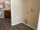 This laundry room includes hookups and is located next to the kitchen at 3355 Abeline Rd, Spring Hill, FL 34608