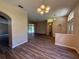 Open-concept living area boasts new floors and easy access to the outdoor patio via sliding glass doors at 3355 Abeline Rd, Spring Hill, FL 34608