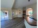 Spacious living space featuring modern floors, a breakfast bar, and outdoor access at 3355 Abeline Rd, Spring Hill, FL 34608