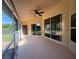 Enclosed patio with a ceiling fan and sliding glass doors leading to outdoor living spaces at 3355 Abeline Rd, Spring Hill, FL 34608