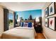 Stylish bedroom features a bold cityscape mural and playful superhero artwork at 37213 Sagemoor Dr, Zephyrhills, FL 33541