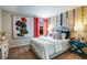 Inviting bedroom with colorful coding decor, a cozy bed, and blue nightstand at 37213 Sagemoor Dr, Zephyrhills, FL 33541