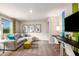 Inviting living room with a sectional sofa, playful decor, and an entertainment unit at 37213 Sagemoor Dr, Zephyrhills, FL 33541