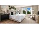 Cozy bedroom with neutral tones, soft carpet, and a large window with a view at 37213 Sagemoor Dr, Zephyrhills, FL 33541