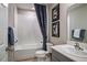 Clean bathroom with a white tile bathtub, shower, and modern fixtures at 37244 Sagemoor Dr, Zephyrhills, FL 33541