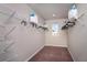 Walk-in closet with wire shelving, ample storage, and carpeted floors at 37244 Sagemoor Dr, Zephyrhills, FL 33541