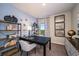 Modern home office with natural light, bookshelves and a desk, perfect for a productive work environment at 37252 Sagemoor Dr, Zephyrhills, FL 33541