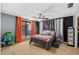 Spacious bedroom featuring hardwood floors, sliding door, and custom shelving at 3961 15Th N Ave, St Petersburg, FL 33713