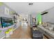 Open concept living room featuring hardwood floors and a flat screen television at 3961 15Th N Ave, St Petersburg, FL 33713