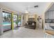 Bright living room with tile floors, ceiling fan and sliding glass doors leading to the pool area at 3961 15Th N Ave, St Petersburg, FL 33713