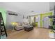 Cozy living room with bright light, comfortable seating, and hardwood floors at 3961 15Th N Ave, St Petersburg, FL 33713