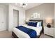 Comfortable bedroom showcasing neutral tones, a plush bed, and ample natural light at 4650 Blue Star Ct, North Port, FL 34289