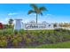 Community entrance sign for Arbor Oaks surrounded by manicured landscaping and greenery at 4650 Blue Star Ct, North Port, FL 34289