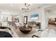 Open-concept living and dining area with stylish accents, a large mirror, and seamless flow to the kitchen at 4650 Blue Star Ct, North Port, FL 34289