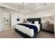 Cozy main bedroom features a tray ceiling, modern decor, and a calming color palette at 4650 Blue Star Ct, North Port, FL 34289