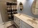 Bathroom with double sinks and shower/tub combo at 4814 Grist Mill Cir, New Port Richey, FL 34655