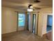 Bright bedroom with sliding door and neutral carpet at 4814 Grist Mill Cir, New Port Richey, FL 34655