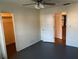A quaint bedroom with an ceiling fan, neutral color scheme, closet and a connecting door frame at 4814 Grist Mill Cir, New Port Richey, FL 34655