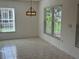 Bright dining area with tile floor and views to exterior at 4814 Grist Mill Cir, New Port Richey, FL 34655