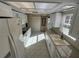 Charming kitchen featuring white cabinets and natural light at 4814 Grist Mill Cir, New Port Richey, FL 34655