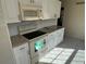 Well-lit kitchen with white appliances and granite countertops at 4814 Grist Mill Cir, New Port Richey, FL 34655