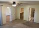 Spacious main bedroom with carpet, fan, and ensuite bathroom at 4814 Grist Mill Cir, New Port Richey, FL 34655