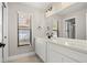 Bright bathroom vanity with ample counter space, storage, and natural light from the window at 5104 E Longboat Blvd, Tampa, FL 33615