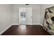 Bedroom showcasing hardwood floors, light grey paint and a pool view through an open door at 5104 E Longboat Blvd, Tampa, FL 33615