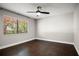 Bedroom boasts hardwood floors, ceiling fan, and bright natural light at 5104 E Longboat Blvd, Tampa, FL 33615