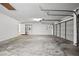 Spacious garage with shelving, doors, and plenty of room for vehicles and storage at 5104 E Longboat Blvd, Tampa, FL 33615