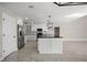 Stylish kitchen with stainless appliances, an island, and abundant cabinet space at 5104 E Longboat Blvd, Tampa, FL 33615