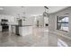 Modern kitchen with granite counters, a center island and stainless steel appliances at 5104 E Longboat Blvd, Tampa, FL 33615