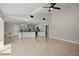 Open concept kitchen featuring a large island, black countertops, and tile flooring at 5104 E Longboat Blvd, Tampa, FL 33615