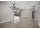 Spacious open living area with modern lighting and a view of the outdoor pool at 5104 E Longboat Blvd, Tampa, FL 33615