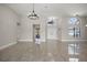 Bright open living area featuring tile floors and arched window architectural details at 5104 E Longboat Blvd, Tampa, FL 33615