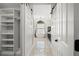 Stunning bathroom with barn doors, chandelier, soaking tub, and an arched window at 5104 E Longboat Blvd, Tampa, FL 33615