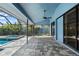 Screened patio with a pool and spa and an expansive brick patio at 5104 E Longboat Blvd, Tampa, FL 33615