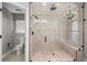 A modern walk-in shower features a built-in bench and dual shower heads at 5104 E Longboat Blvd, Tampa, FL 33615